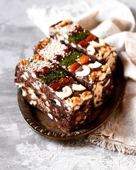 Chocolate halva with different nuts