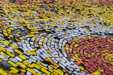 Fragment of an old wall olor mosaic close-up. Smalt..