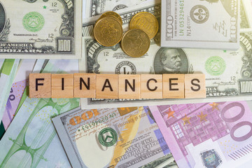 Fototapeta na wymiar word text finance or finances on the money banknotes background