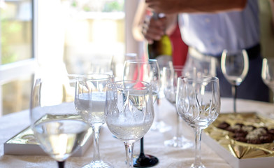 Man pours champagne into glasses 1