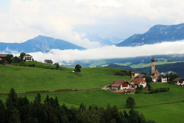 Fototapeta na wymiar Village in the foothills of the Dolomites