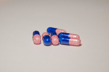 A lot of pills. A medicine for a sick person.