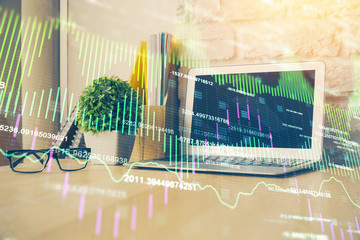 Double exposure of forex chart and work space with computer. Concept of international online trading.