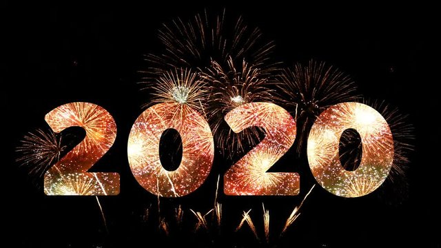 4K. firework of year 2020 greeting during new year eve countdown celebration, loop of real golden and heart shape fireworks festival in the sky display at night with colorful