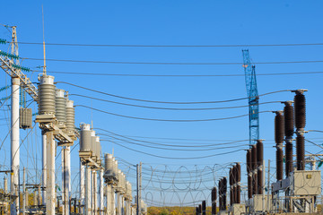 High voltage pole power transformer substation. State facility violating the environment. Search for alternative energy to replace electricity.