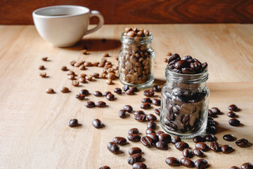 Fototapeta na wymiar Coffee cups and roasted coffee beans