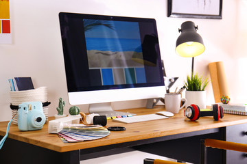 Comfortable designer's workplace with modern computer in studio
