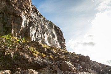 Beautiful wet stones illuminated by the sun in the Faroe Islands