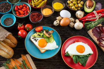 Fototapeta na wymiar Fried eggs, boiled eggs and omelette on the rustic table
