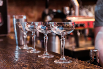 The bartender mixes a summer cocktail at the bar