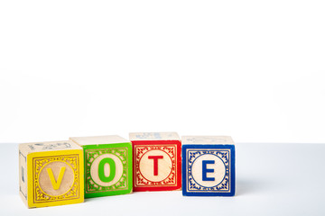 Childrens Wooden Alphabet Blocks Spelling the Word Vote © monitor6