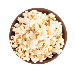 Bowl of tasty pop corn isolated on white, top view