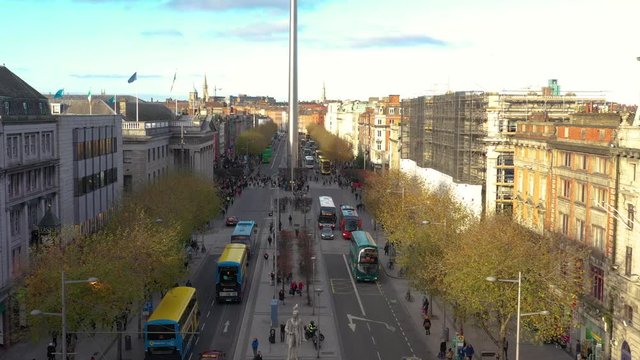 aerial view of city center of Dublin with Spire of Dublin, cars, buses and people on the street 