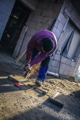 Worker With Grinder Cut Iron 