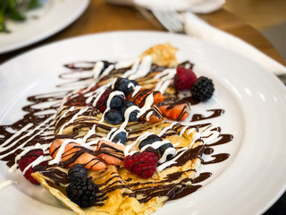 delicious home made pancakes with fresh fruits & chocolate glaze
