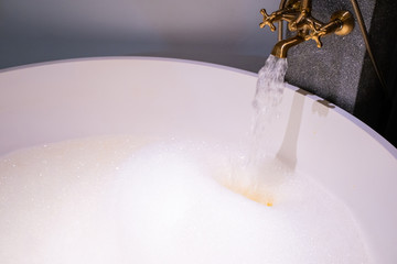 open warm water into bathtub