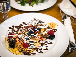 delicious home made pancakes with fresh fruits & chocolate glaze