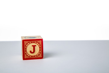 Childrens Wooden Alphabet Block Showing the Letter J