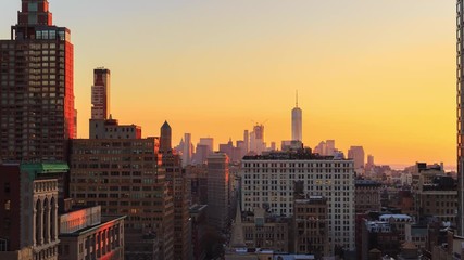 Aerial view of Manhattan skylines at sunset with Flatiron Building and One World