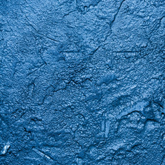 Blue background, rough stucco texture, banner