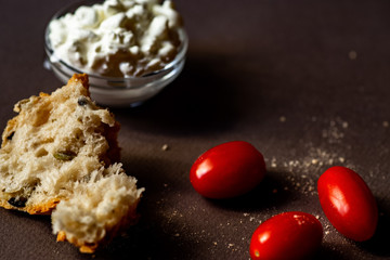Ripped bread, cherry tomatoes and cottage cheese.