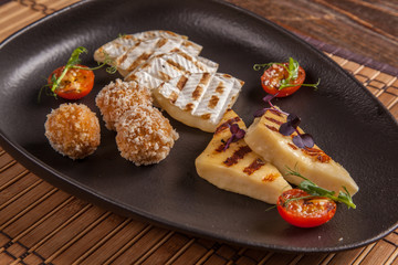 A set of fried cheeses on a plate