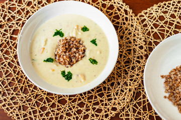 Creamy white vegetable soup with buckwheat.