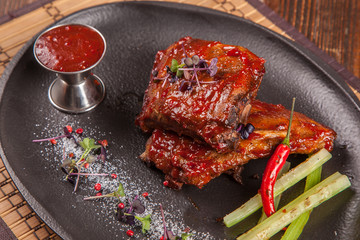 a Pork ribs with sauce