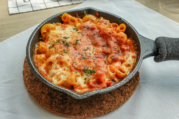 Baked creamy, mac and cheese with minced meat, italian ground beef bolognese casserole