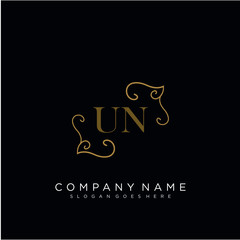 Initial letter UN logo luxury vector mark, gold color elegant classical