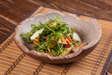 Salad with arugula and roast pork