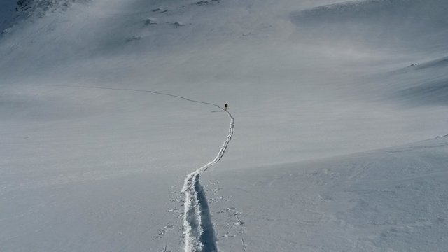 Ski touring, snowboarding and splitboarding in a Beautiful snowy winter mountain landscape in the Swiss alps