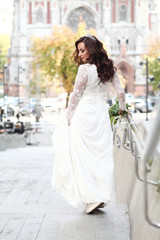 Beautiful bride in white dress with crown