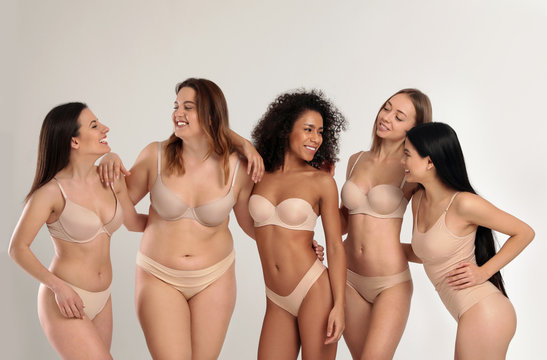 Rear View Of Three Women With Different Body Types In Underwear