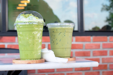 Iced green tea is placed on the table in the cafe.