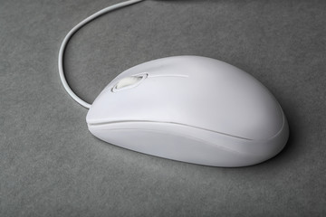 Modern wired computer mouse on grey background