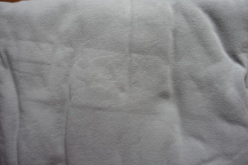 Rippled light grey cotton fabric from above