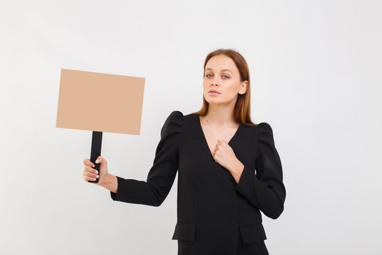 portrait of young business woman fighting for feminism, holding posters promoting, girl in black dress isolated over white background