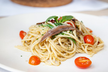 Spaghetti with anchovy, cherry tomato, onion, chili and pamersan cheese