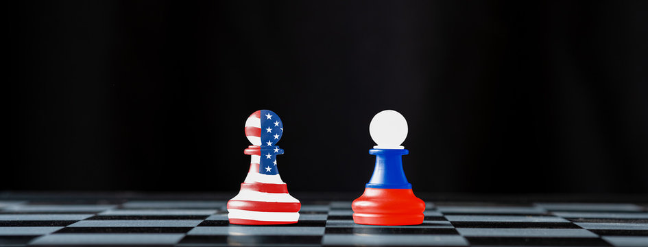 USA and Russia flag print screen on pawn chess with black background.It is symbol of tariff trade war tax barrier between United States of America and Russia.-Image.