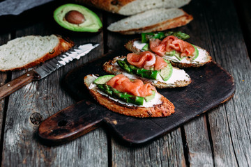 Sandwich with cream cheese, avocado, asparagus and salted salmon