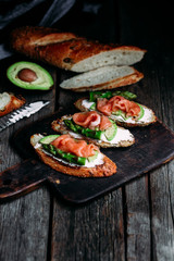 Sandwich with cream cheese, avocado, asparagus and salted salmon