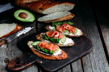 Sandwich with cream cheese, avocado, asparagus and salted salmon