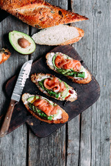 Sandwich with cream cheese, avocado, asparagus and salted salmon