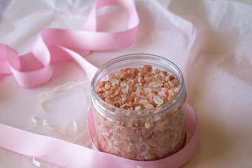 salt on baths. Spa at home. pink crystals. space for text. the view from the top. body scrub. cosmetics for the skin. the concept of female beauty. skin and body care. body cosmetics.