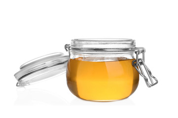 Jar of organic honey isolated on white