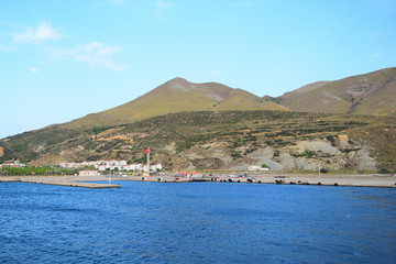 Fototapeta na wymiar Kuzu Liman harbor - Seascape from turkish aegean island Gokceada made from the ship
