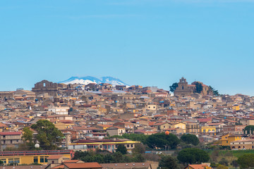 Fototapeta na wymiar Cityscape of Mazzarino with the Mount Etna in the Background, Caltanissetta, Sicily, Italy, Europe