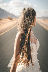 woman in white dress on the road