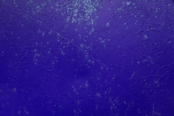 Rusty indigo color metal texture background. Old worn blue and violet iron door. Close up, copy space